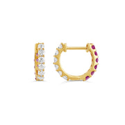 Exquisite two-tone huggie earrings featuring alternating rows of sparkling diamonds and vibrant pink sapphires set in gold, blending elegance and luxury for a glamorous look.