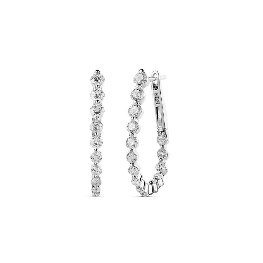 Close-up image of diamond hoop earrings crafted in 18-karat white gold, featuring a continuous row of brilliant-cut diamonds totaling 1.59 carats. The elegant design highlights their sparkling beauty and luxurious craftsmanship.